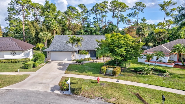 view of front of home featuring a front lawn and a garage