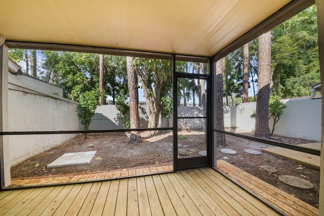 unfurnished sunroom featuring a wealth of natural light