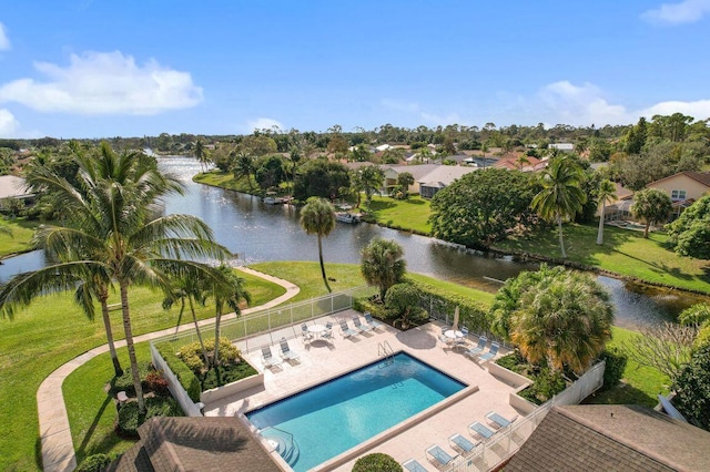 view of pool featuring a water view and a patio