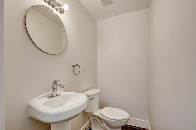 bathroom with sink and toilet