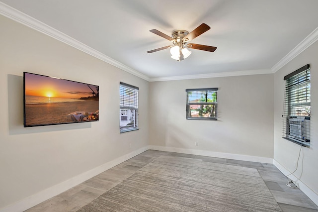 spare room with crown molding and ceiling fan