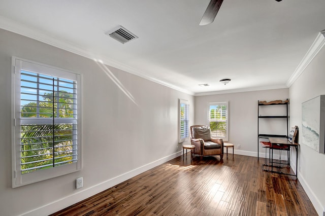 living area with crown molding, ceiling fan, and dark hardwood / wood-style floors