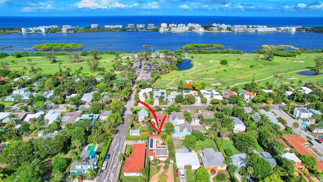 birds eye view of property with a water view