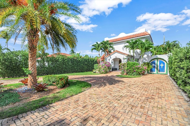 mediterranean / spanish-style house with french doors