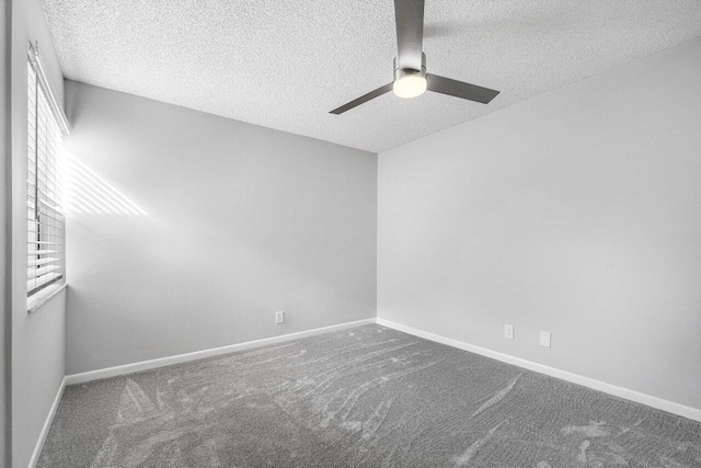 carpeted empty room featuring a textured ceiling and ceiling fan