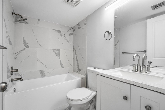 full bathroom with vanity, toilet, and tiled shower / bath combo