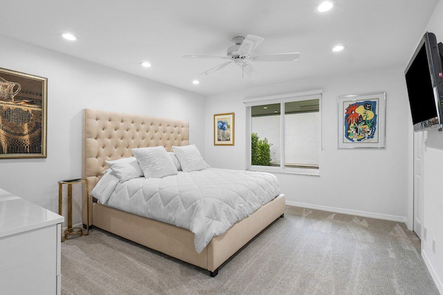 bedroom with light colored carpet and ceiling fan