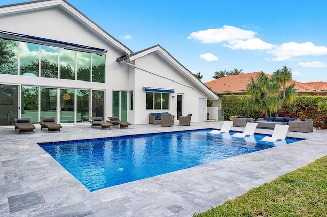 view of pool featuring an outdoor living space and a patio