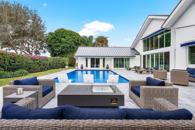 view of swimming pool featuring an outdoor living space and a patio