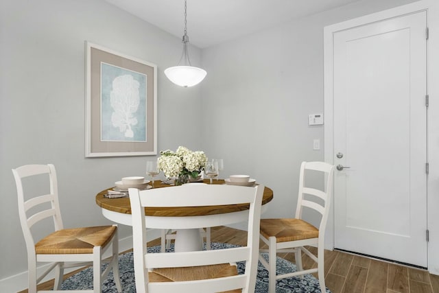 dining area featuring dark hardwood / wood-style flooring