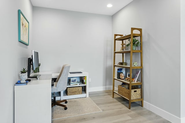 office with light hardwood / wood-style floors