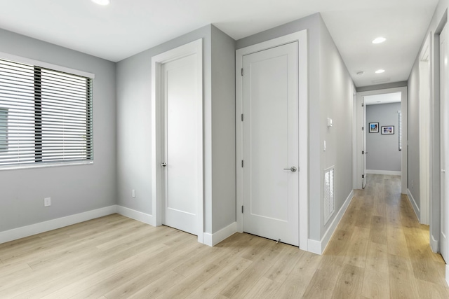 hallway featuring light hardwood / wood-style flooring