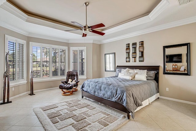 tiled bedroom with ceiling fan, a raised ceiling, and crown molding