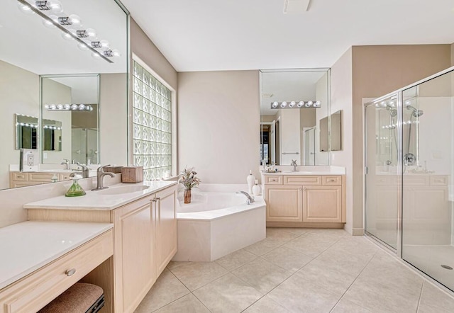 bathroom featuring tile patterned flooring, vanity, and plus walk in shower