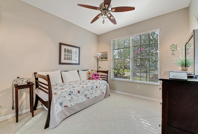 bedroom with ceiling fan and light tile patterned flooring