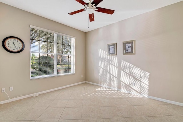 tiled empty room with ceiling fan