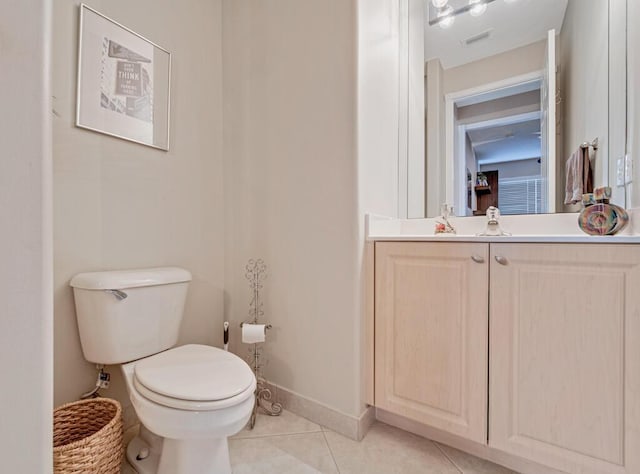 bathroom with tile patterned floors, vanity, and toilet