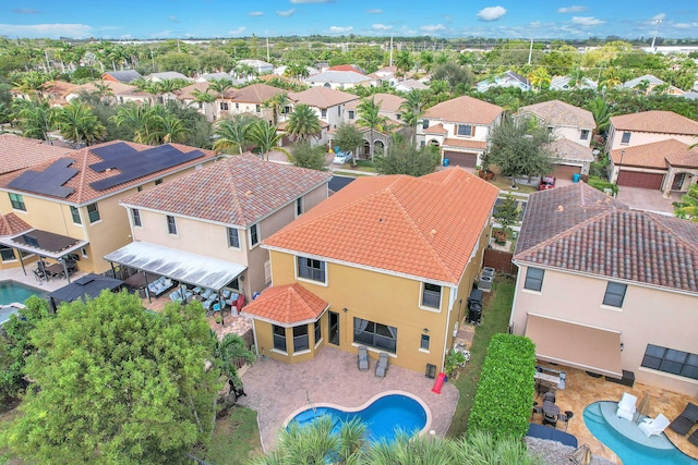 birds eye view of property with a residential view