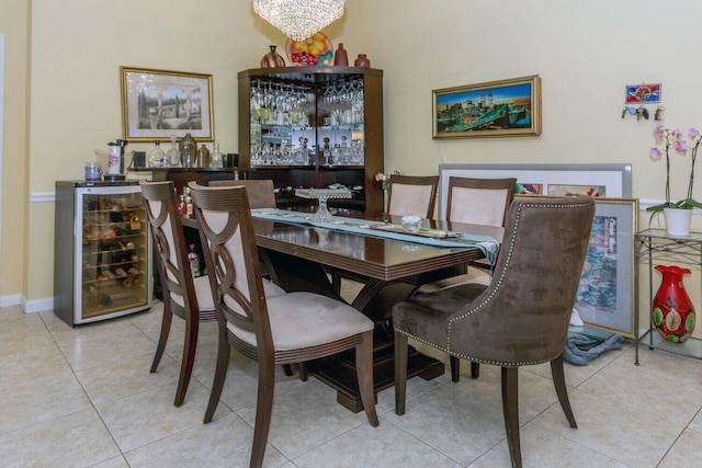 tiled dining space with bar area, beverage cooler, and a notable chandelier