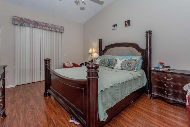 bedroom featuring vaulted ceiling, ceiling fan, and dark hardwood / wood-style flooring