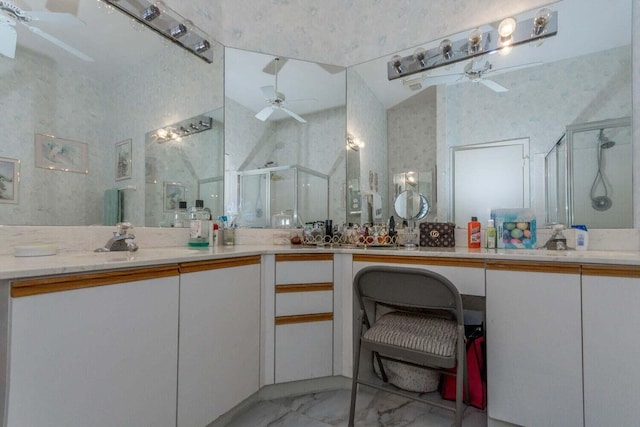 bathroom featuring an enclosed shower, vanity, and ceiling fan