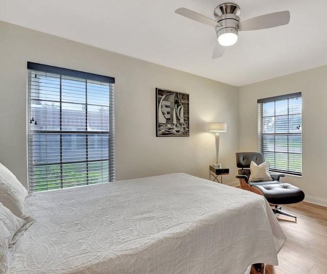 bedroom featuring ceiling fan and light hardwood / wood-style floors