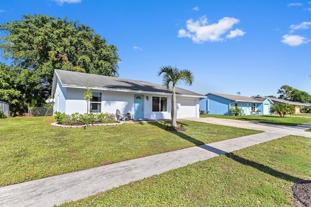 ranch-style home with a garage and a front yard