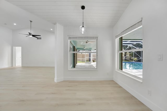 unfurnished dining area featuring light hardwood / wood-style flooring, wood ceiling, and lofted ceiling