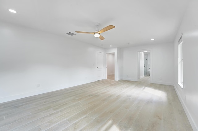 spare room featuring ceiling fan and light hardwood / wood-style floors