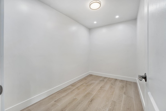 spare room featuring light hardwood / wood-style flooring