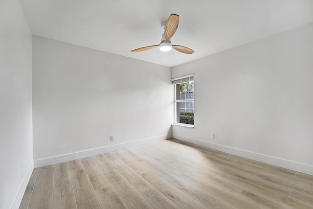 unfurnished room with ceiling fan and light hardwood / wood-style floors