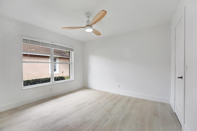 empty room with light wood-type flooring and ceiling fan