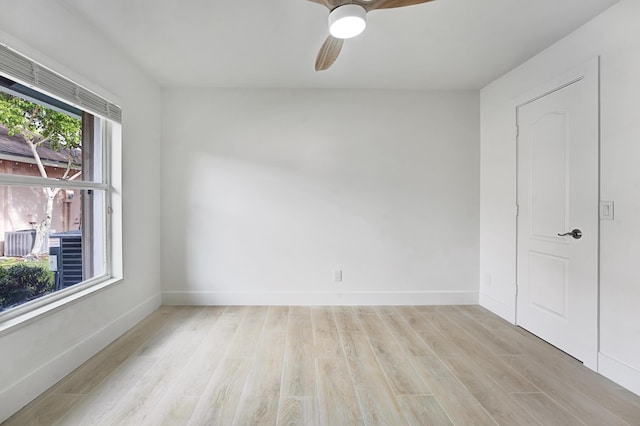 unfurnished room featuring ceiling fan and light hardwood / wood-style flooring