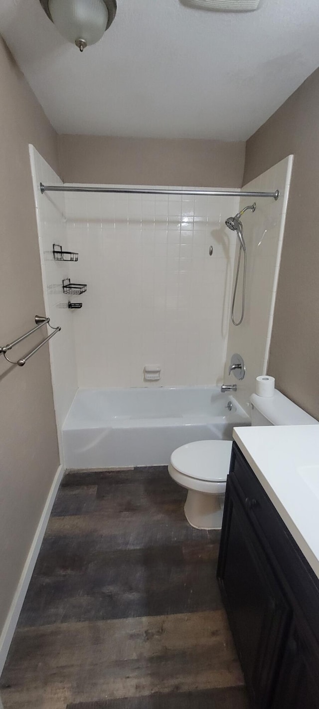 full bathroom with vanity, toilet, shower / bath combination, and hardwood / wood-style floors