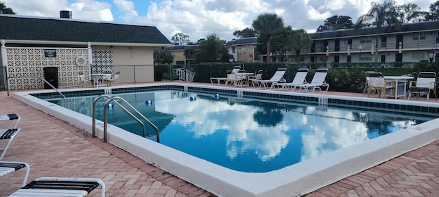 view of swimming pool with a patio area