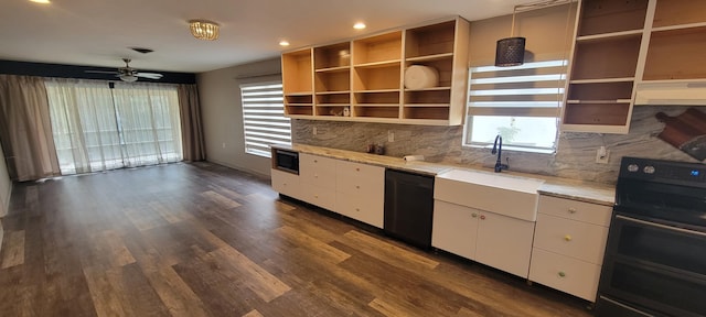 kitchen with sink, decorative light fixtures, electric range oven, black dishwasher, and white cabinets