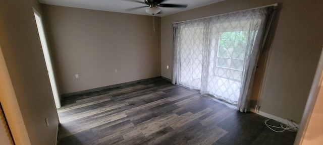 spare room featuring dark hardwood / wood-style floors and ceiling fan