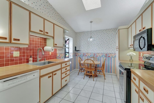 kitchen with dishwasher, sink, hanging light fixtures, cream cabinets, and stainless steel electric stove