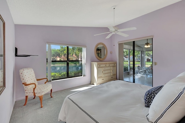 bedroom with access to exterior, ceiling fan, and vaulted ceiling