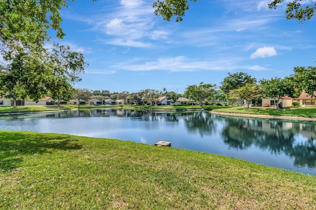 ranch-style home with a front lawn and a garage