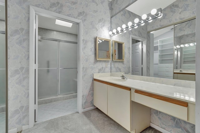 bathroom with vanity and an enclosed shower