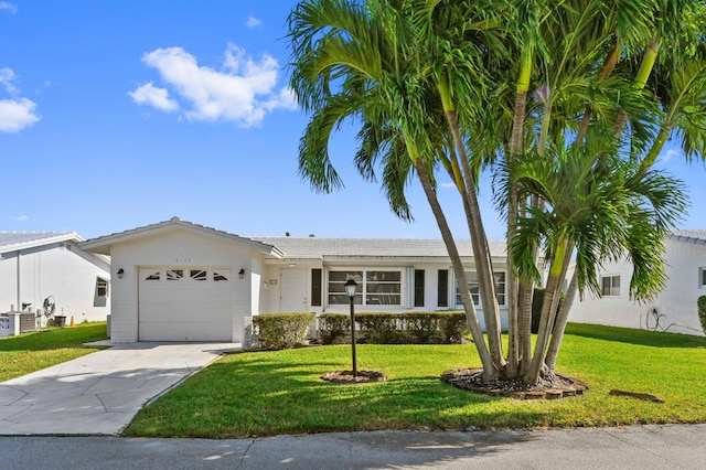 ranch-style home with a front yard and a garage