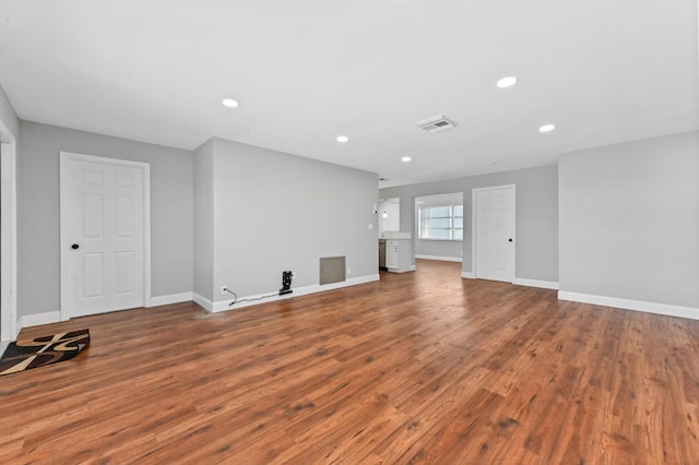 unfurnished living room with hardwood / wood-style floors