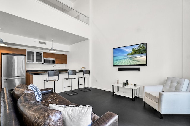 living room featuring a high ceiling