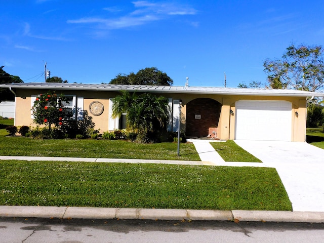 ranch-style home with a garage and a front lawn