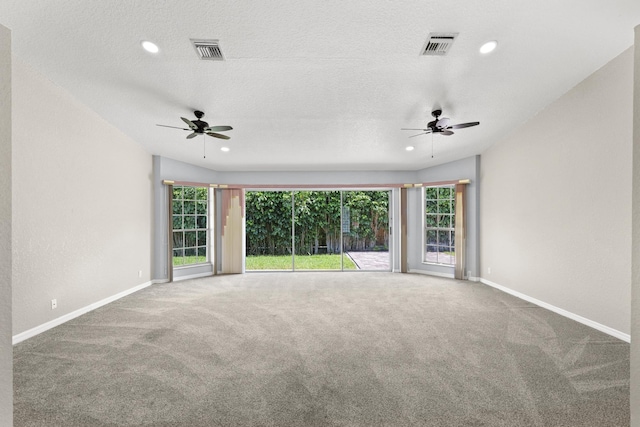 unfurnished room featuring carpet flooring, a textured ceiling, and ceiling fan