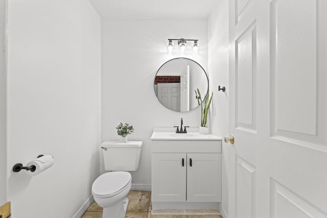 bathroom with tile patterned floors, vanity, and toilet