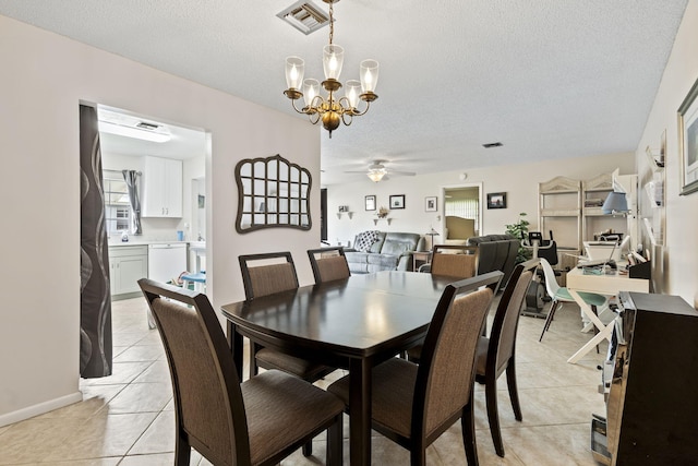 dining space featuring a wealth of natural light, light tile patterned flooring, ceiling fan with notable chandelier, and a textured ceiling