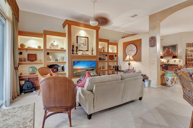 living room with ceiling fan and light tile patterned floors