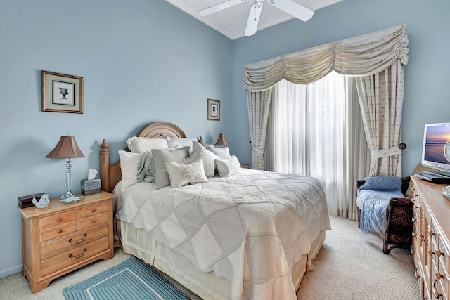 carpeted bedroom with multiple windows and ceiling fan